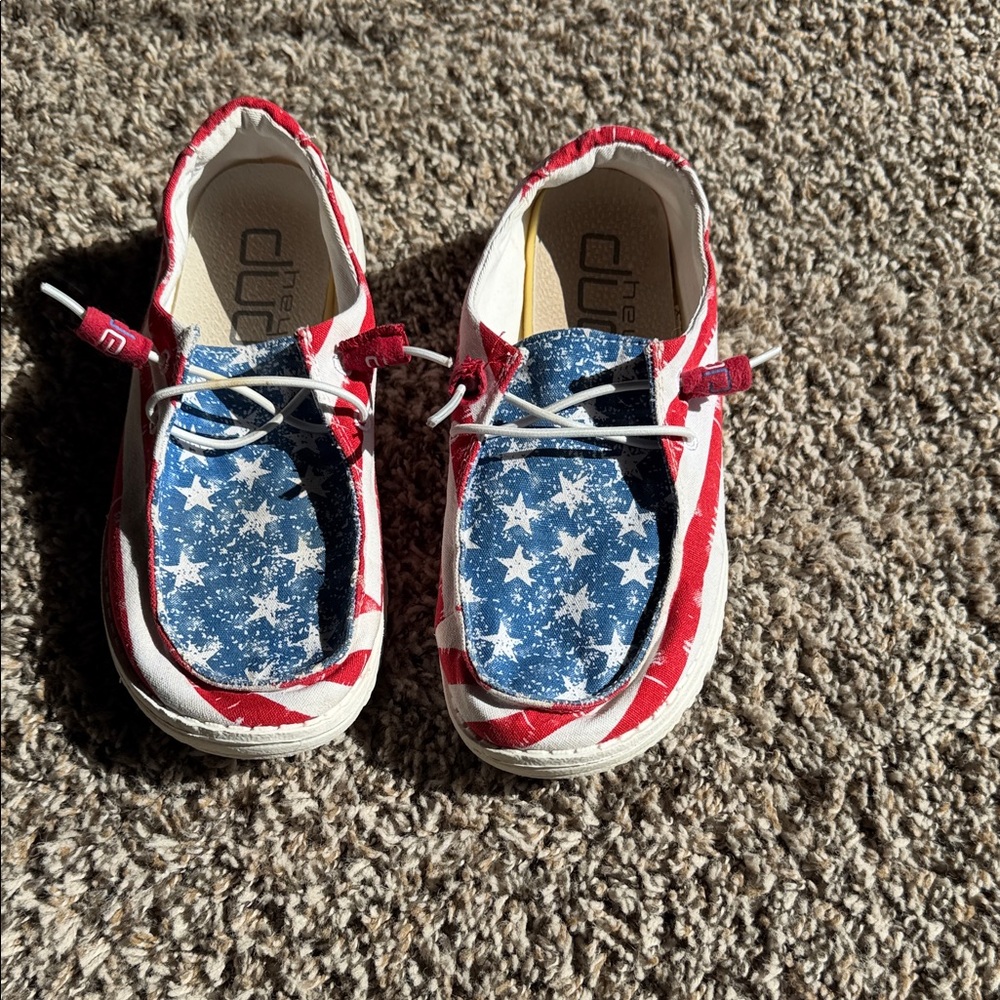 Hey Dude Women’s Slip-On Sneakers in Red, White & Blue Star Print